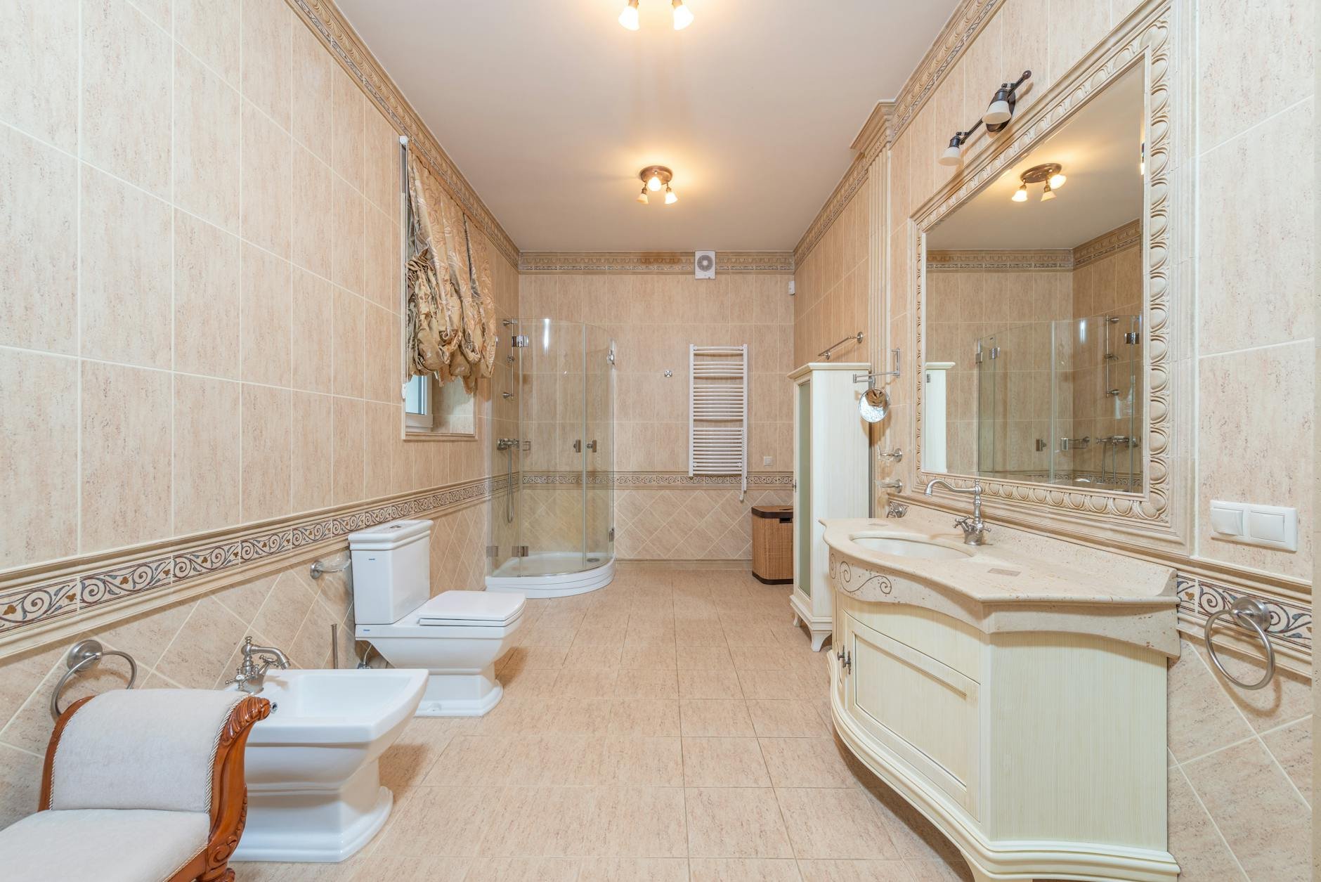 Dark mold growing in the corner of a shower, indicating the need for mold remediation