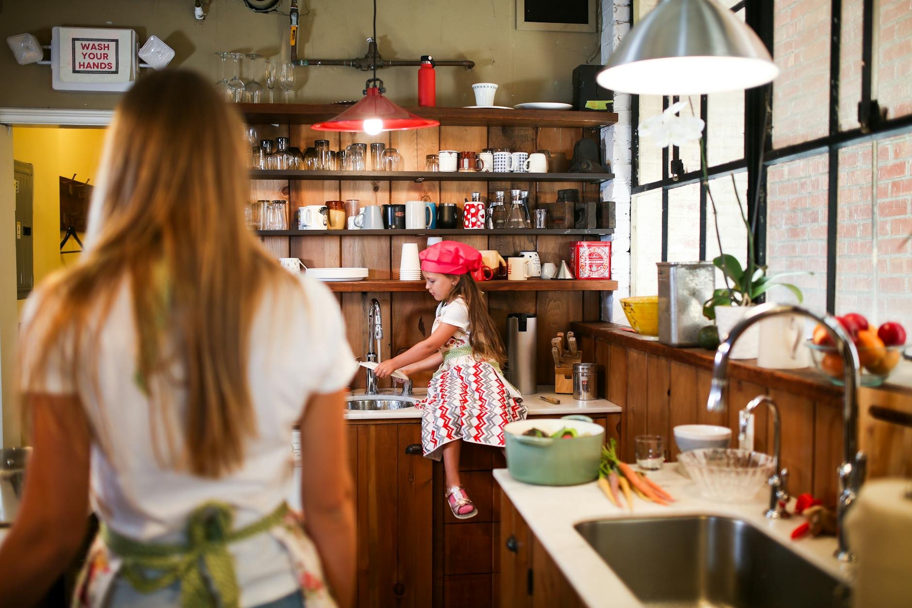 A cleaning professional deep cleaning a kitchen, comparing deep vs. standard cleaning